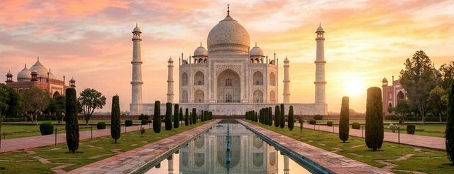 Majestic white marble Taj Mahal at sunrise reflecting in the pool in Agra